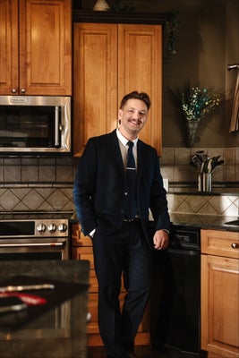 Portrait of Travis Kuhn, Associate.